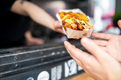 person getting food from food truck