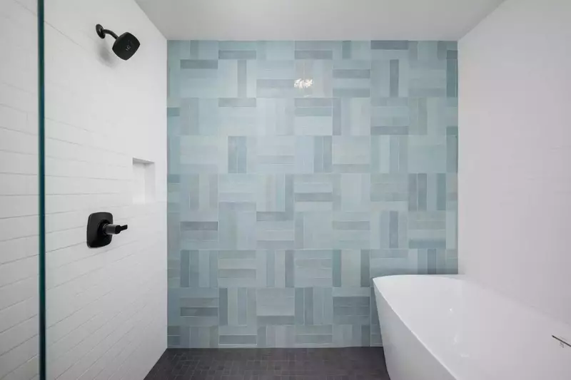 The shower is spacious, up to date, and has excellent water pressure.