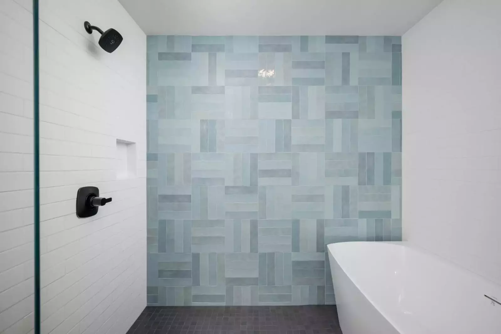 The shower is spacious, up to date, and has excellent water pressure.