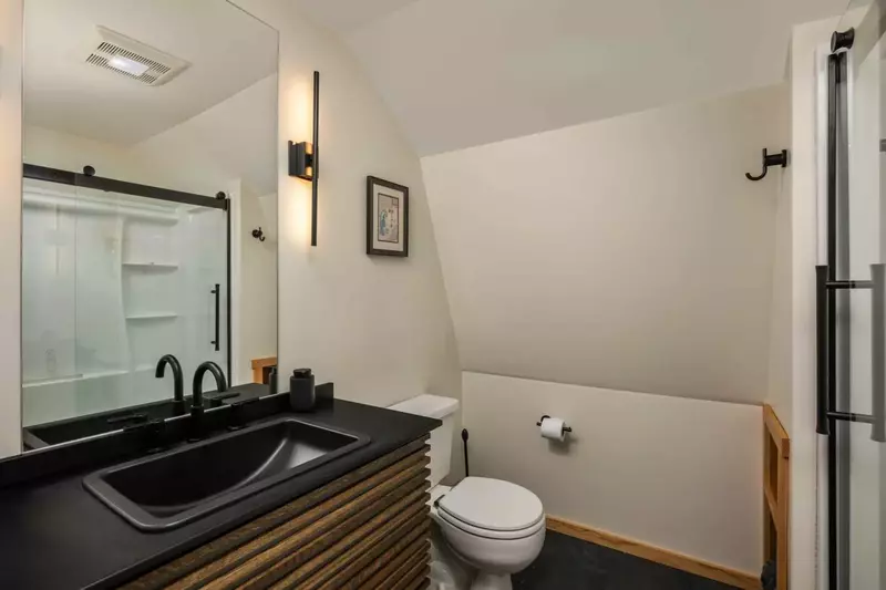 The bathroom is recently updated and ornately decorated.