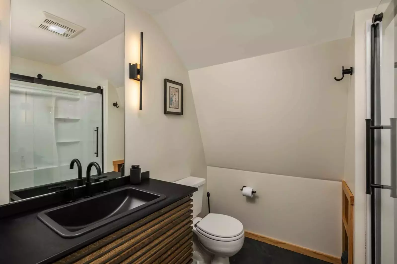 The bathroom is recently updated and ornately decorated.