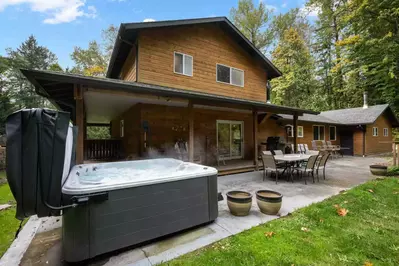 The hot tub is a favorite amenity perfect during warm summers and enchanting winters.