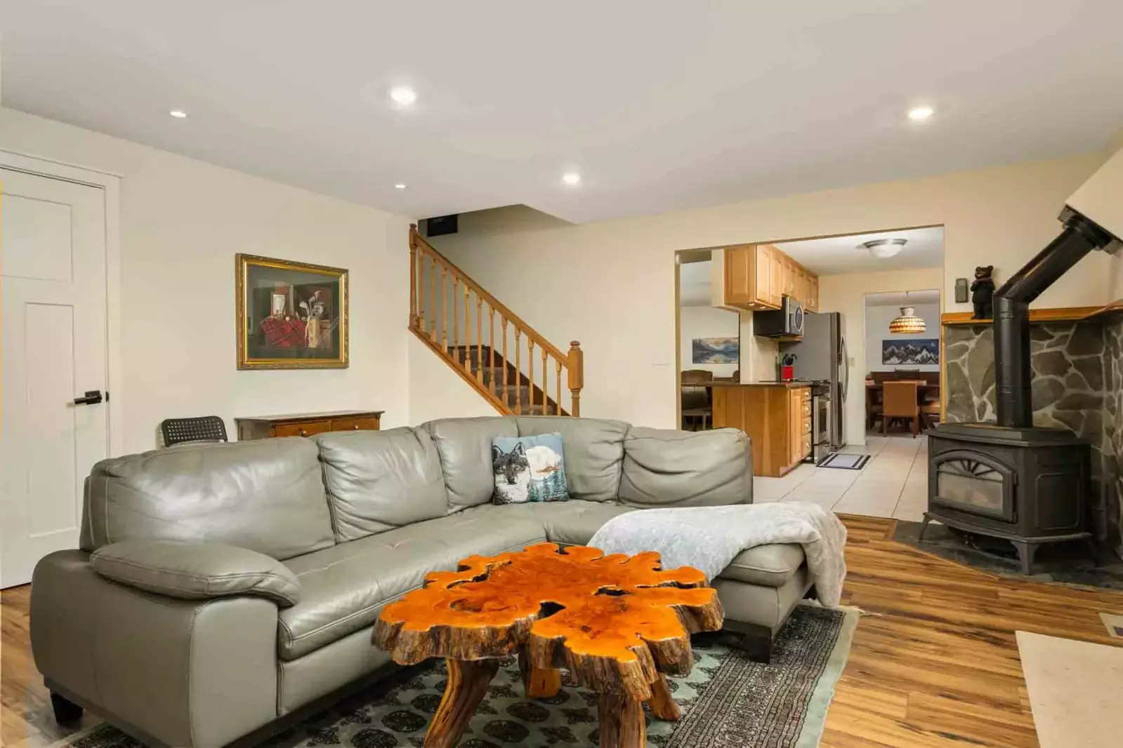 Enjoy fun mountain decor and amenities like the carved coffee table and old fashioned stove.