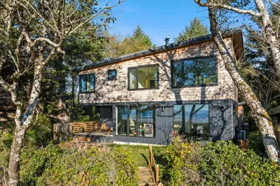 CoHo vista is nestled amongst coastal trees right by the sandy shores of Rockaway Beach.