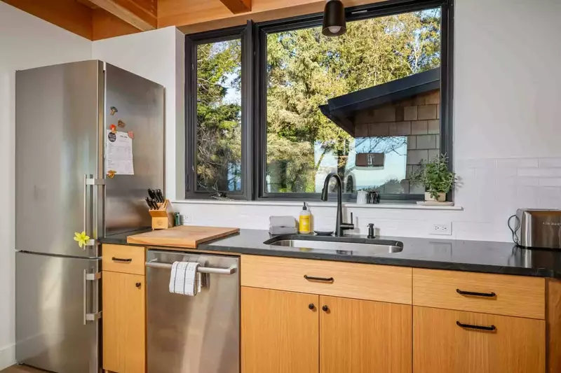 The kitchen is spacious and efficient with state of the art appliances. Perfect place to prepare a family meal.