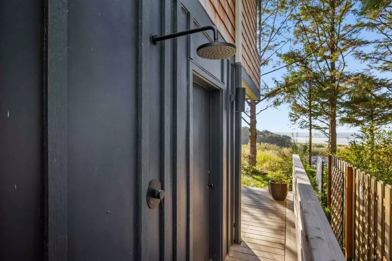 An outdoor shower to wash off in after a fun day on the beach.