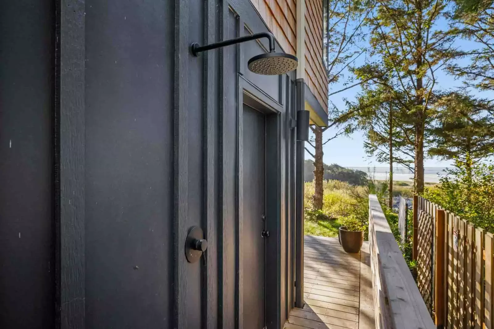 An outdoor shower to wash off in after a fun day on the beach.