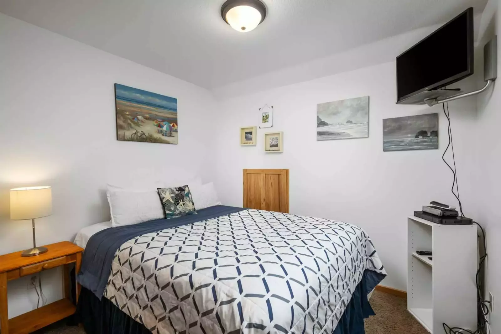 Another comfortable bed with a smart tv.