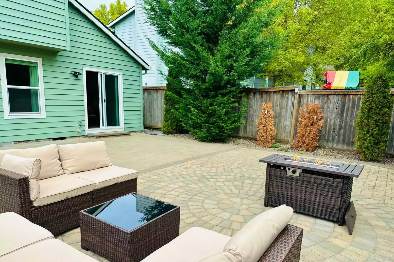 Enjoy a spacious area in the back while relaxing near the firepit (weather dependent).