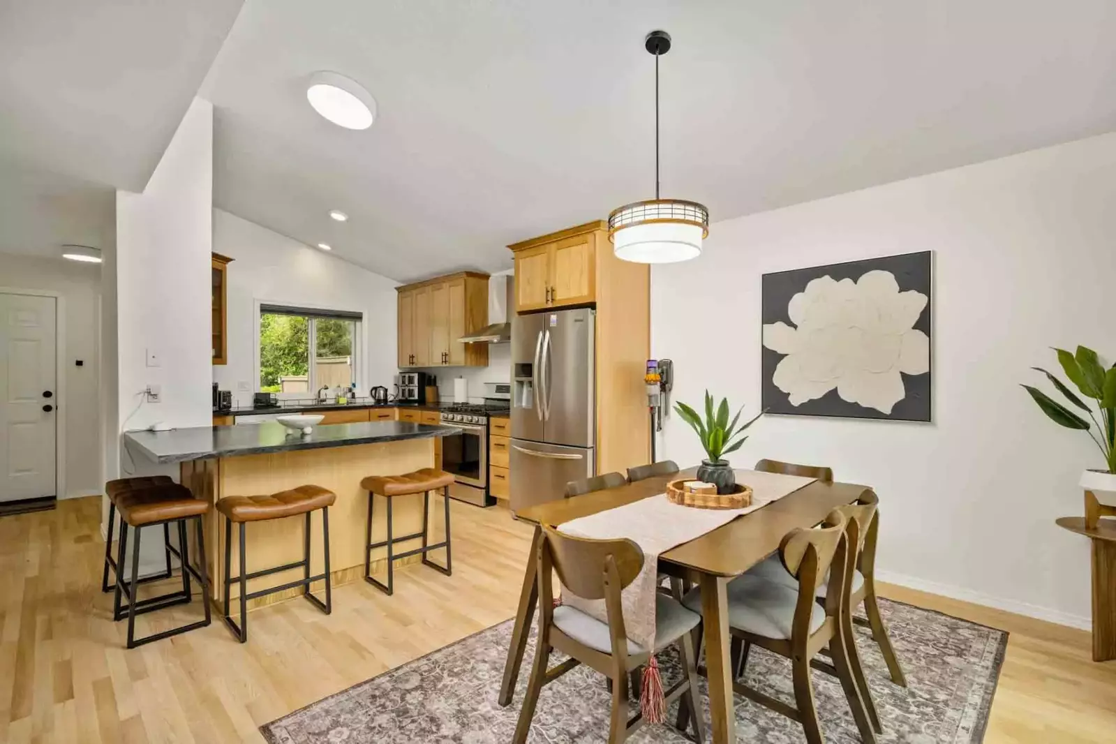 The kitchen and dining room are both spacious. This rental is a perfect place to enjoy a feast!