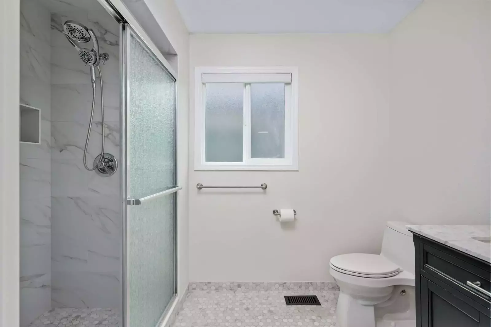 Another bathroom featuring a shower with robust water pressure.