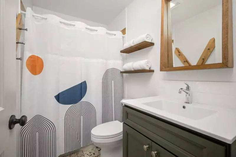 The bathroom is recently updated and ornately decorated.