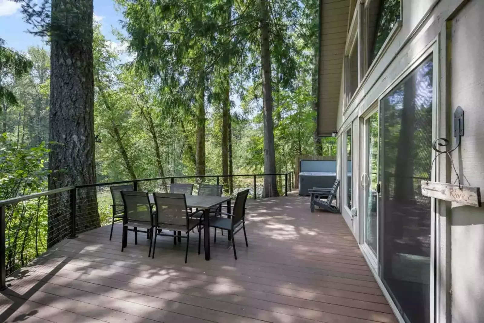 The deck is a perfect place to hang out and enjoy the forest and river view.