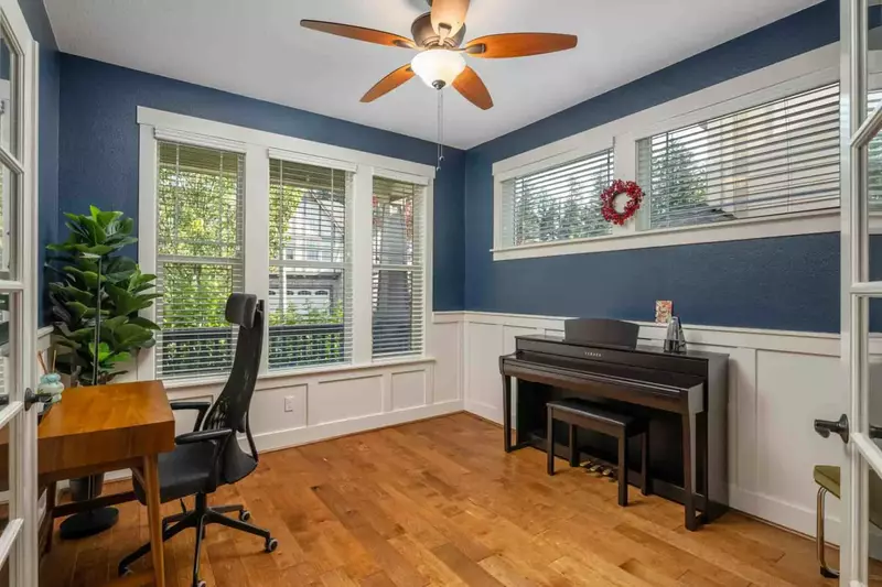 The home office also includes a small piano.