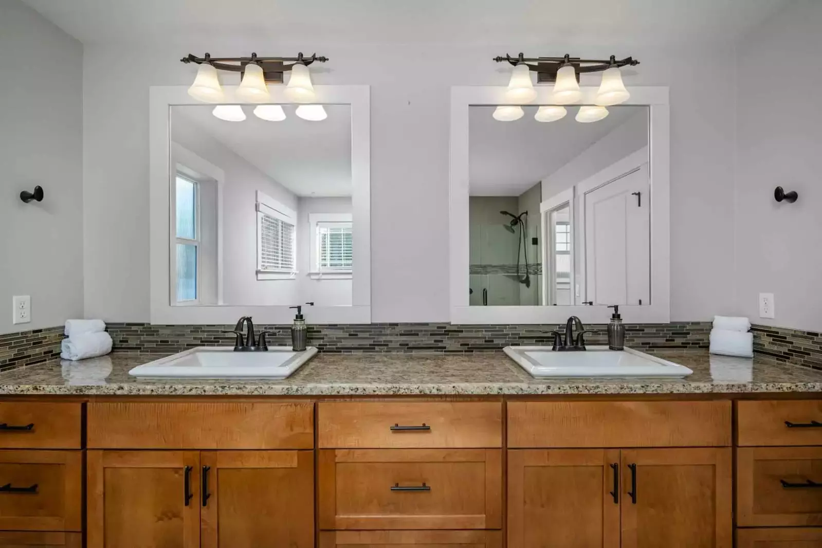 A spacious bathroom with two sinks.