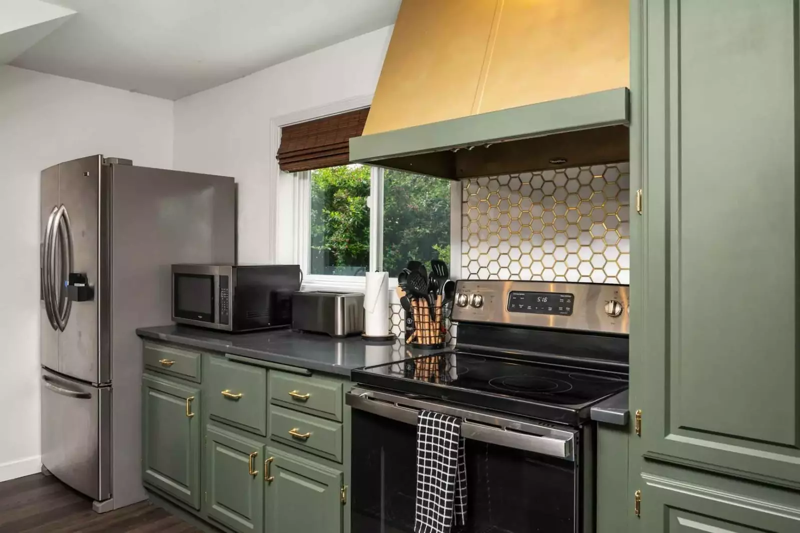 The kitchen is gorgeous with lovely counters and up to date appliances.