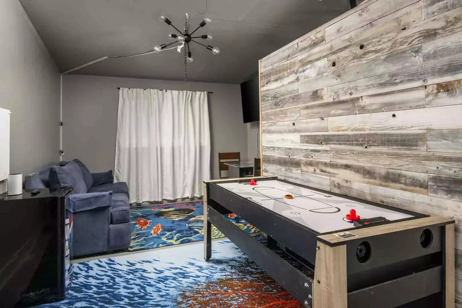 The game room is a fun place to hang out with friends and family. Enjoy the arcade, air hockey, a tv, and more.