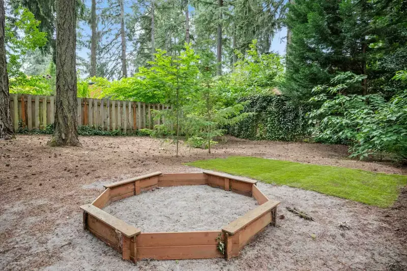 The yard also has a sand pit!