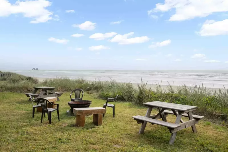 Enjoy a view of Twin Rocks from the beachfront yard.