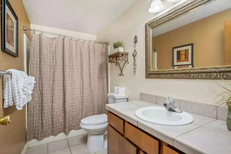 The bathroom is recently updated and ornately decorated.