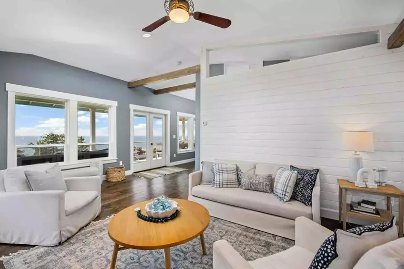 The living room is a comfy place to relax after a day on the beach.