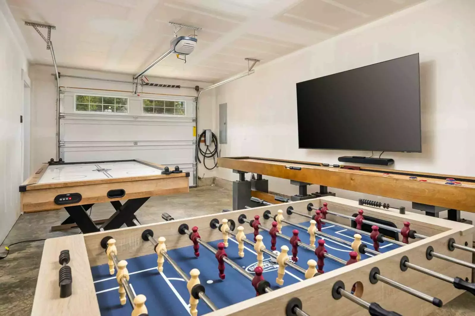 Watch a movie or play a game in the converted game room.