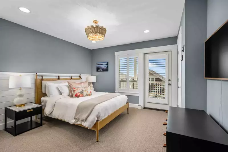 Another comfortable bed with a smart tv.