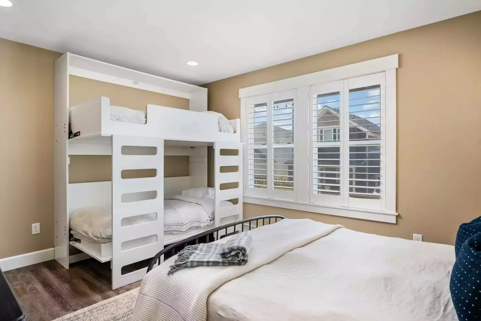 The  queen/bunk combo room is a perfect place for a family.