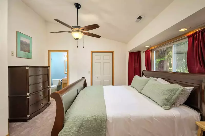 This room has a king bed, efficient ceiling fan, and an en suite bathroom.
