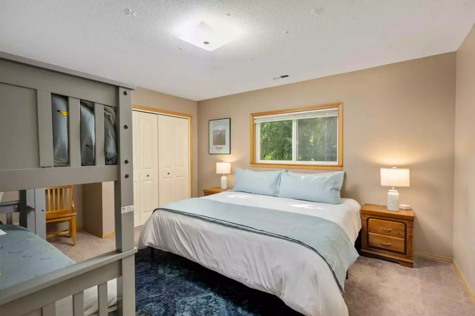 This room has a king bed and a twin bunk.