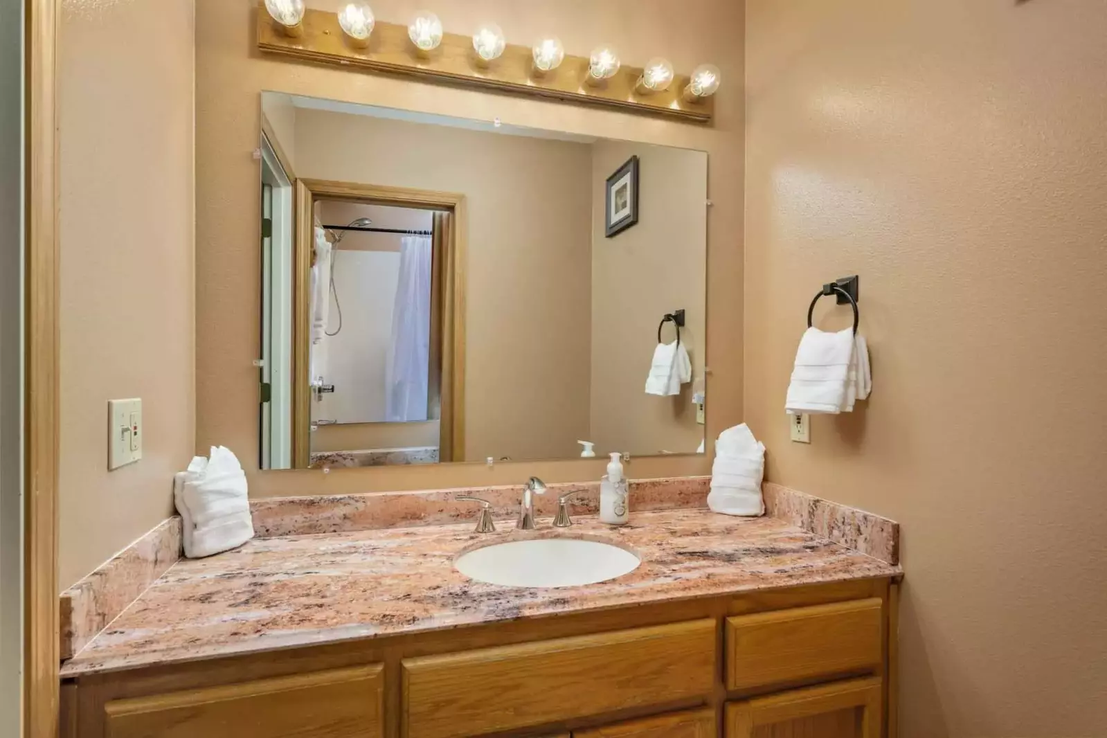 The bathroom is recently updated and decorated.