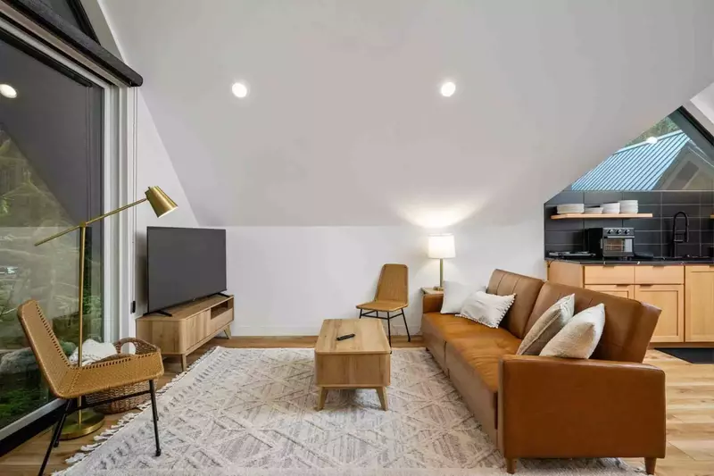 Another smart tv and cosy couch.