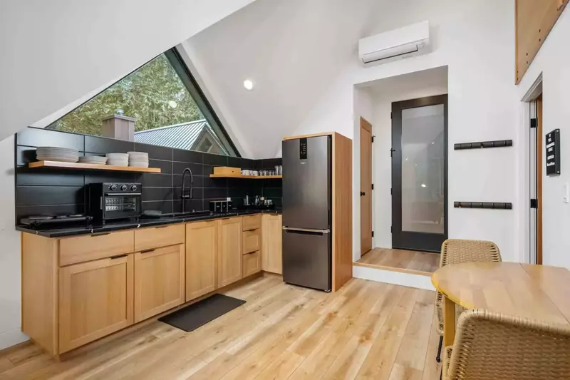 An upstairs kitchenette with a robust supply of appliances.