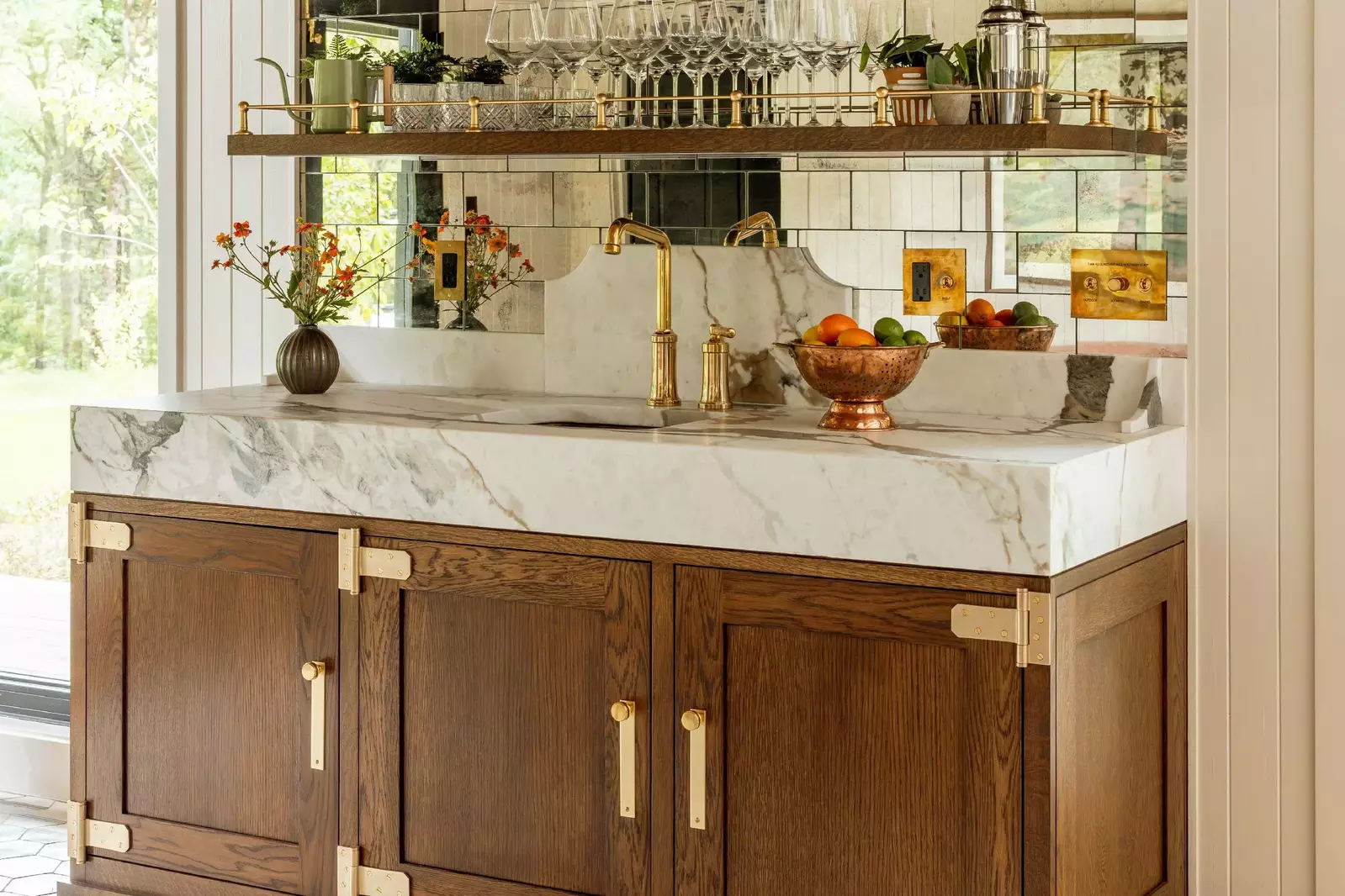 The minibar has a robust supply of glassware, mixing supplies, and a beautiful counter.