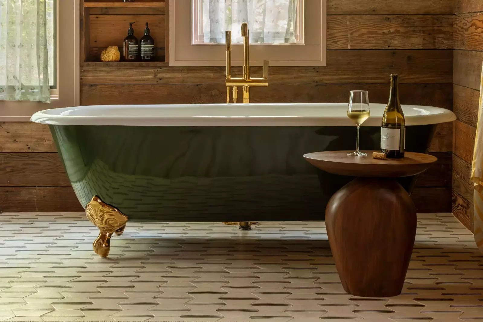 Relax after a day of adventures in the tub. Treat yourself to a glass of wine.