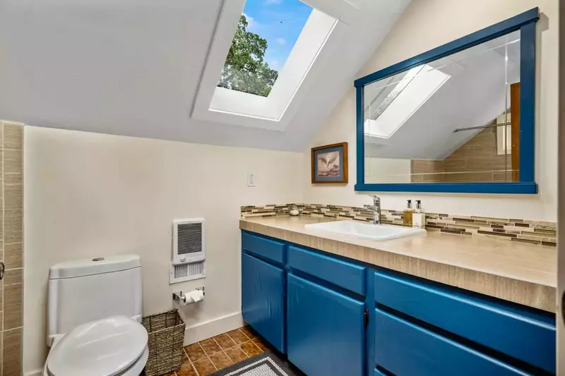 The bathroom is recently updated and decorated.