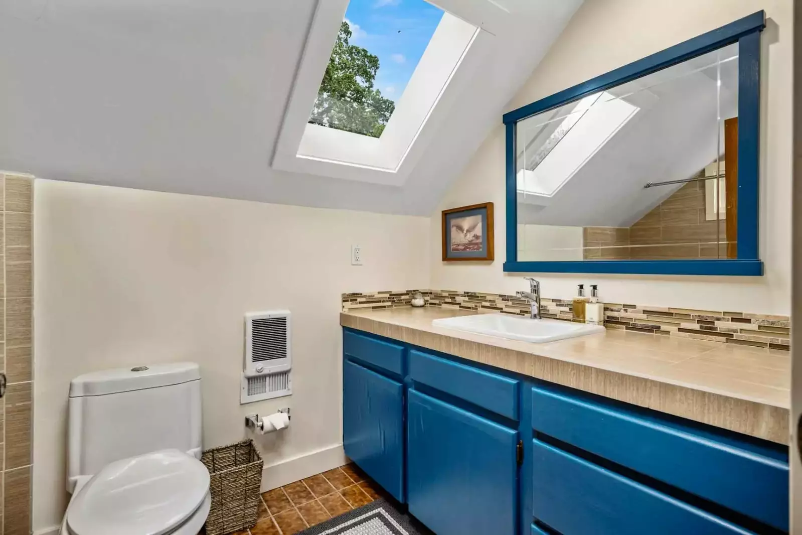 The bathroom is recently updated and decorated.