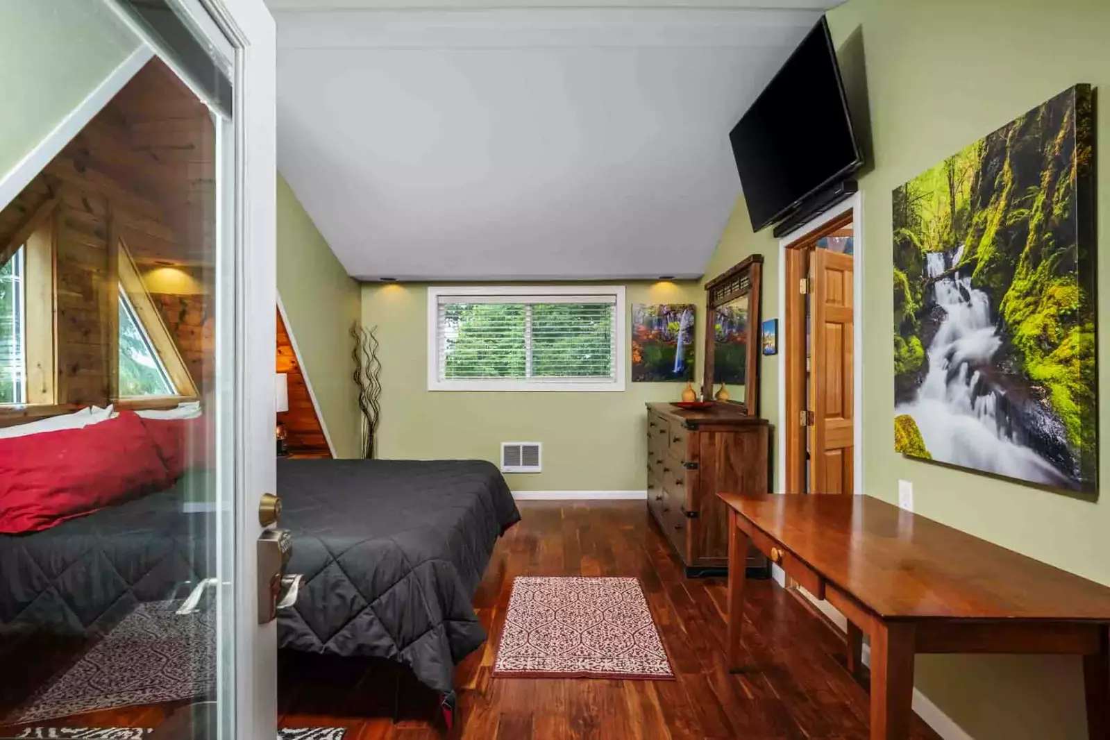 The cottage has a king bed, smart tv, and a charming design.