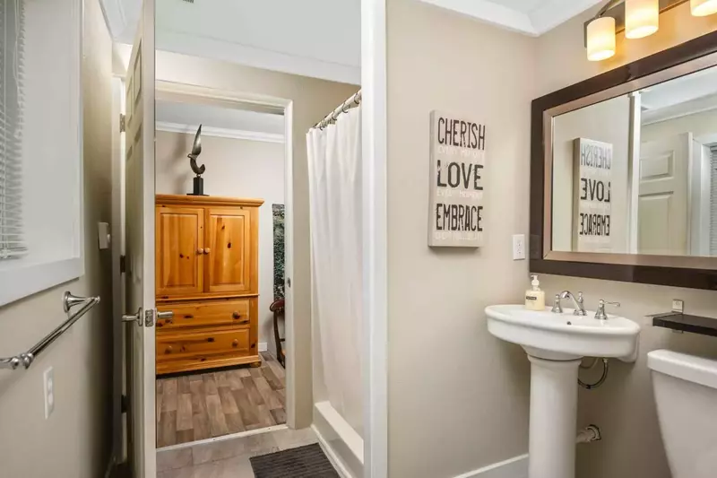 Another bathroom featuring great design and a shower with robust water pressure.