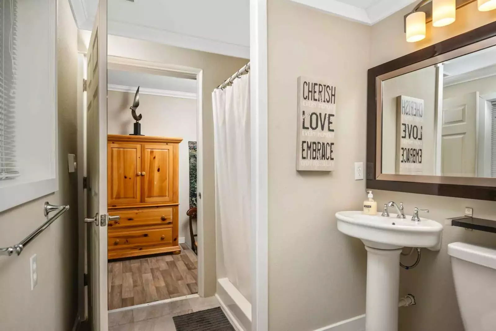 Another bathroom featuring great design and a shower with robust water pressure.