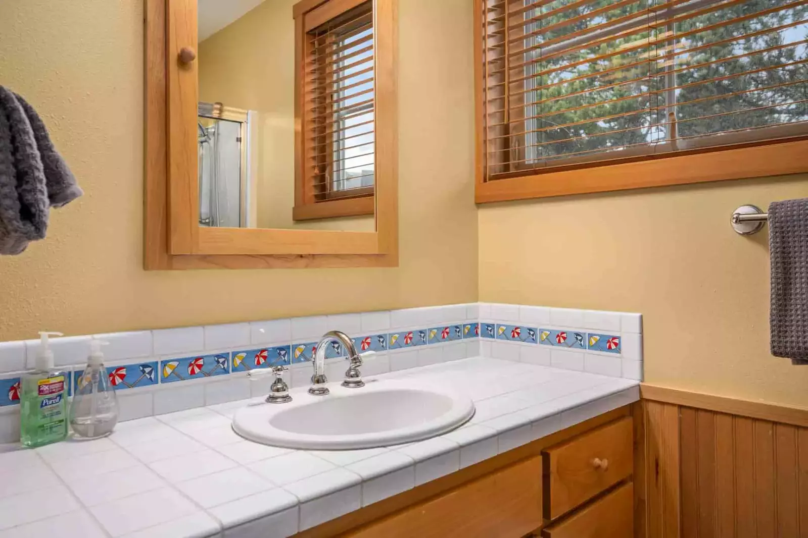 The bathroom is recently updated and decorated.