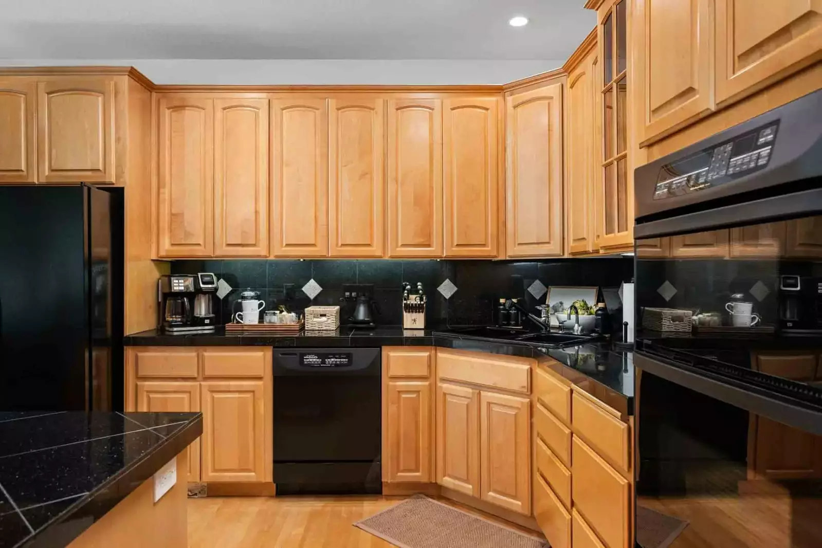 The kitchen has ample counter space and appliances.