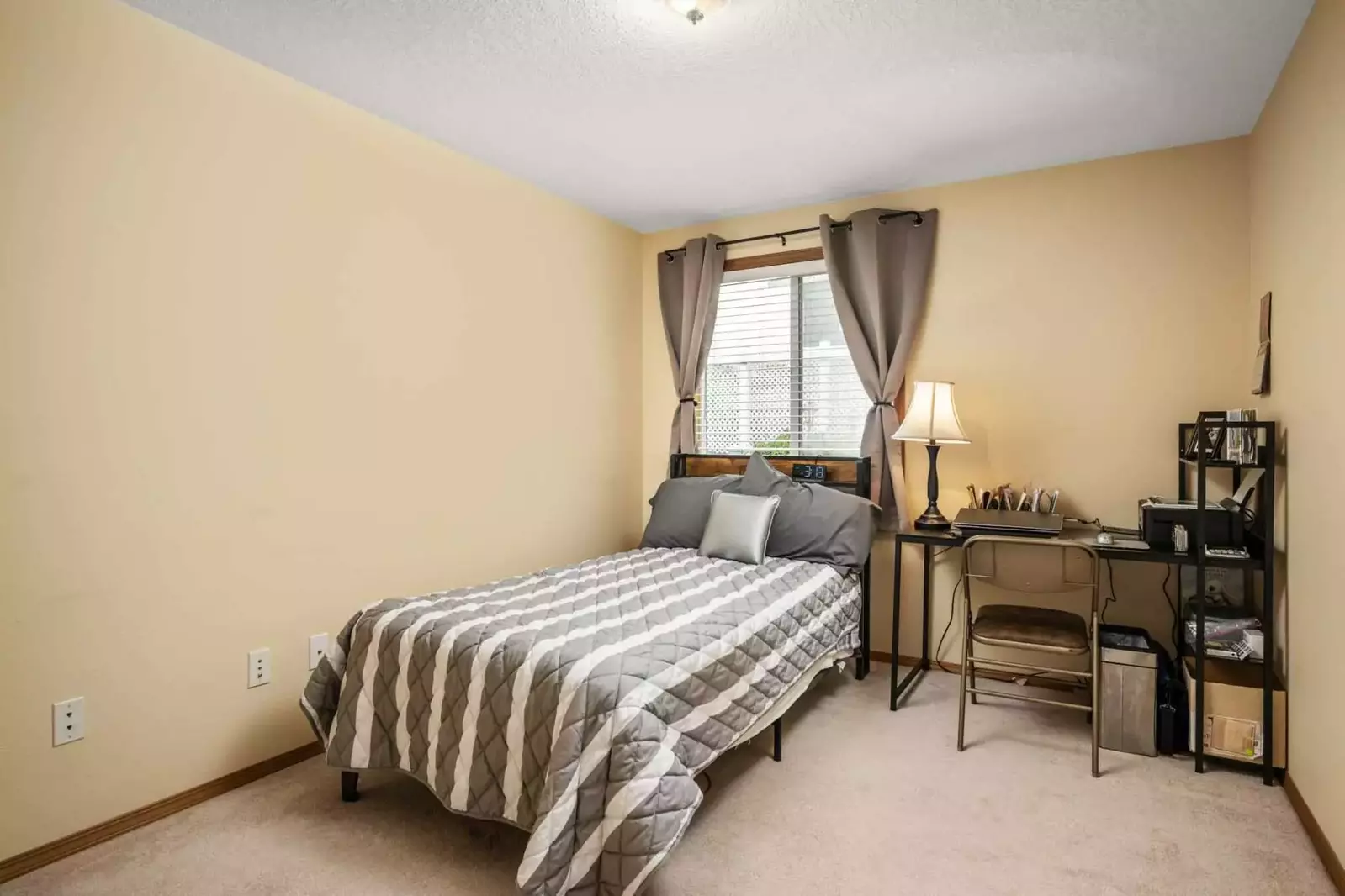 A bedroom that can also serve as a home office.