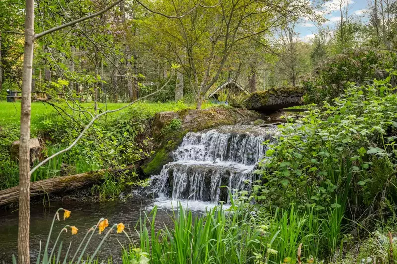 The property has a waterfall on the grounds!