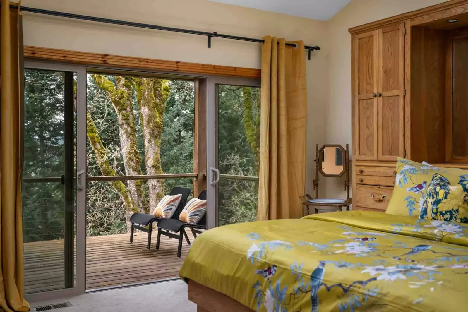This bedroom has direct access to the porch and lovely natural views.