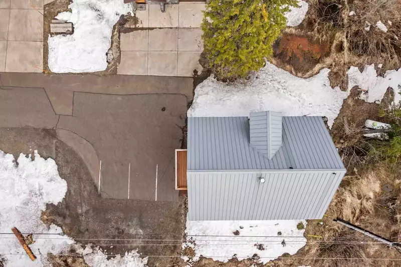 The driveway and road are plowed during winter.