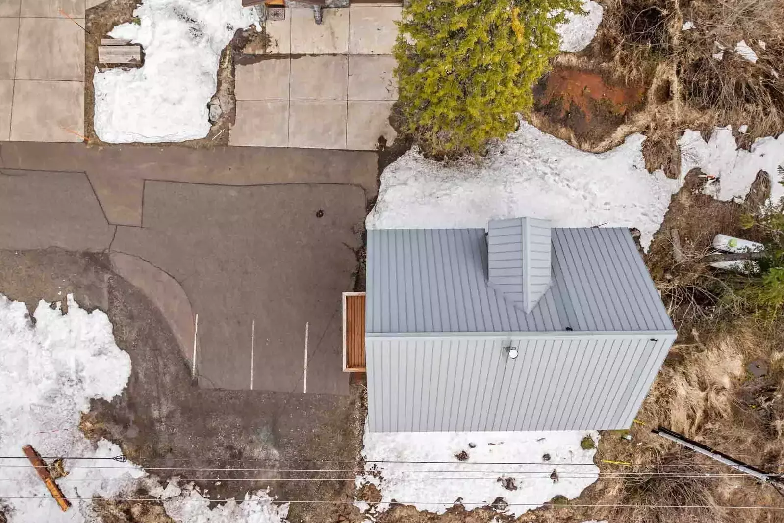 The driveway and road are plowed during winter.