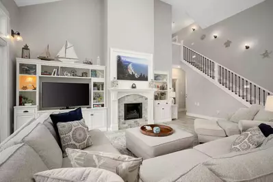 Relax in the living room in front of a cozy fire.