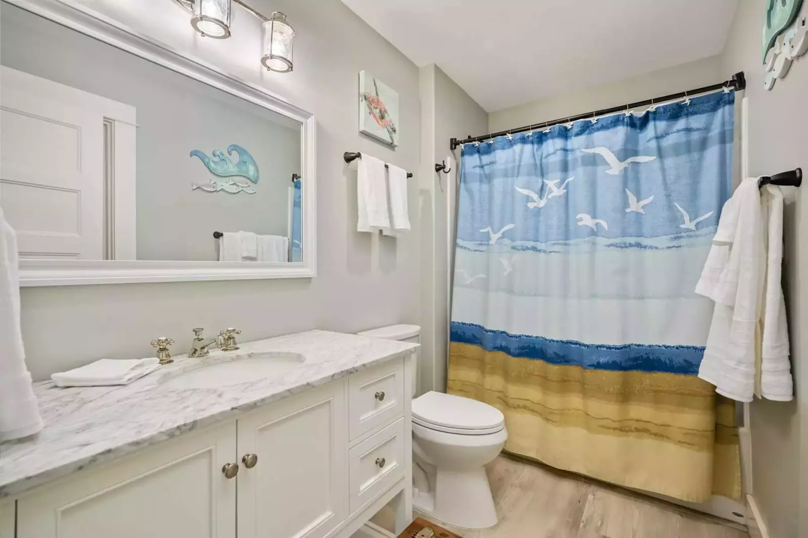 The bathroom is recently updated and decorated.