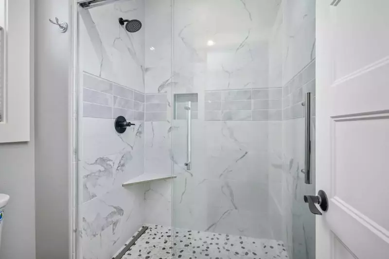 The shower is spacious, up to date, and has excellent water pressure.